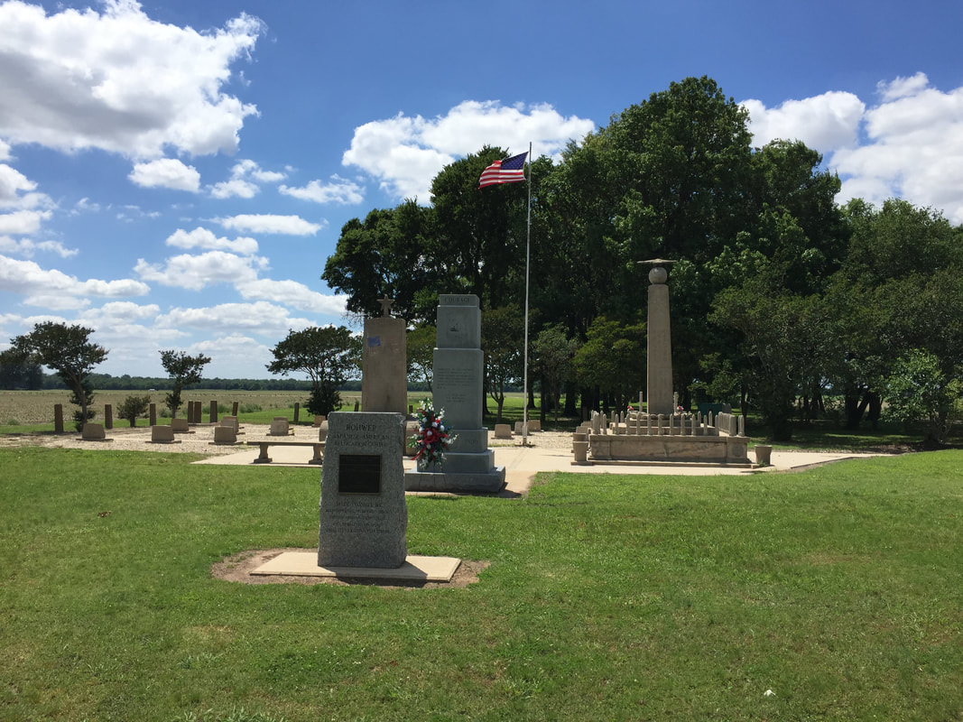 Rohwer Memorials with Graves Behind Them